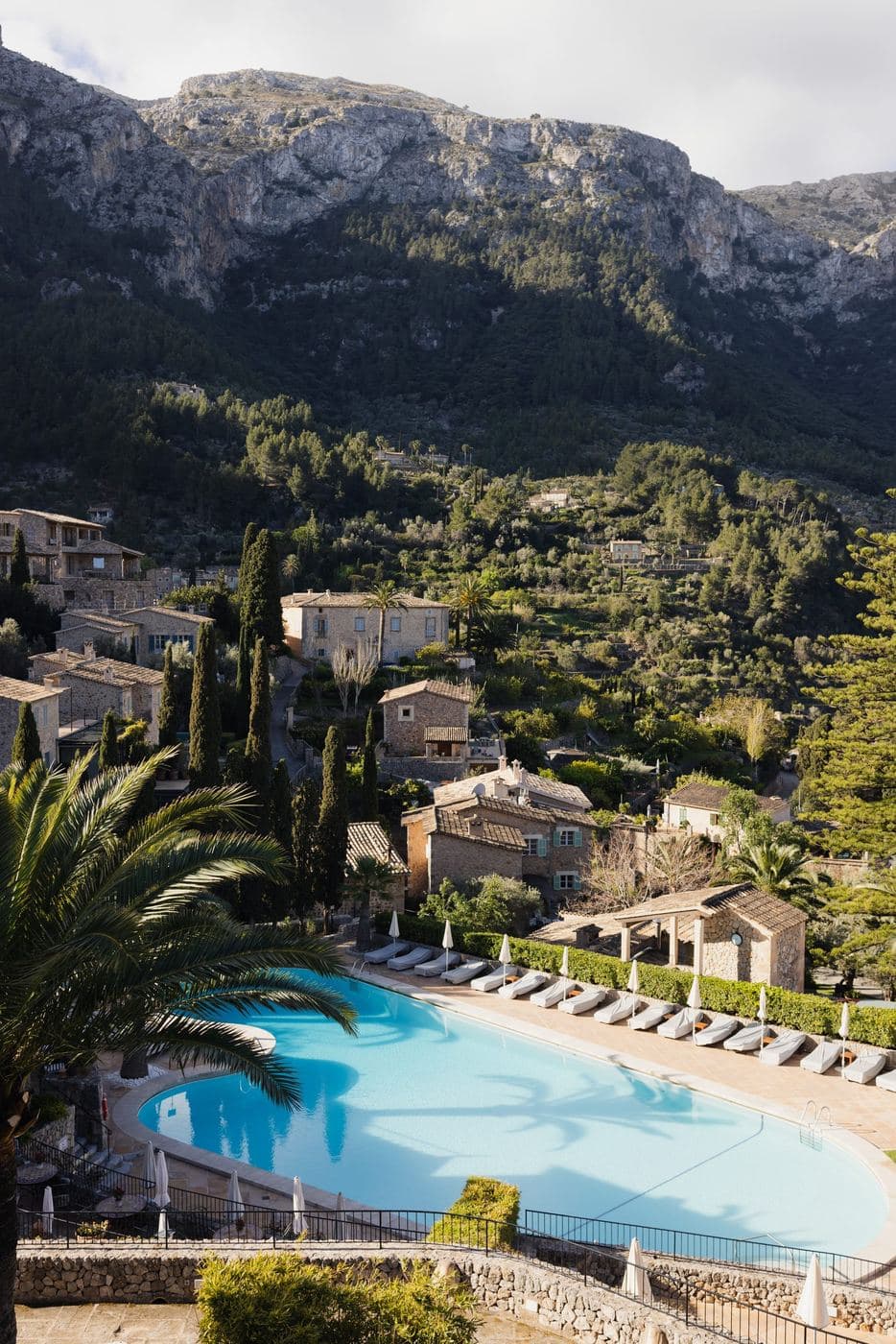 The pool at La Residencia, with Deià and the Tramuntana mountains
